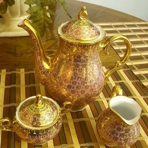 Tea sets with gold engravings.